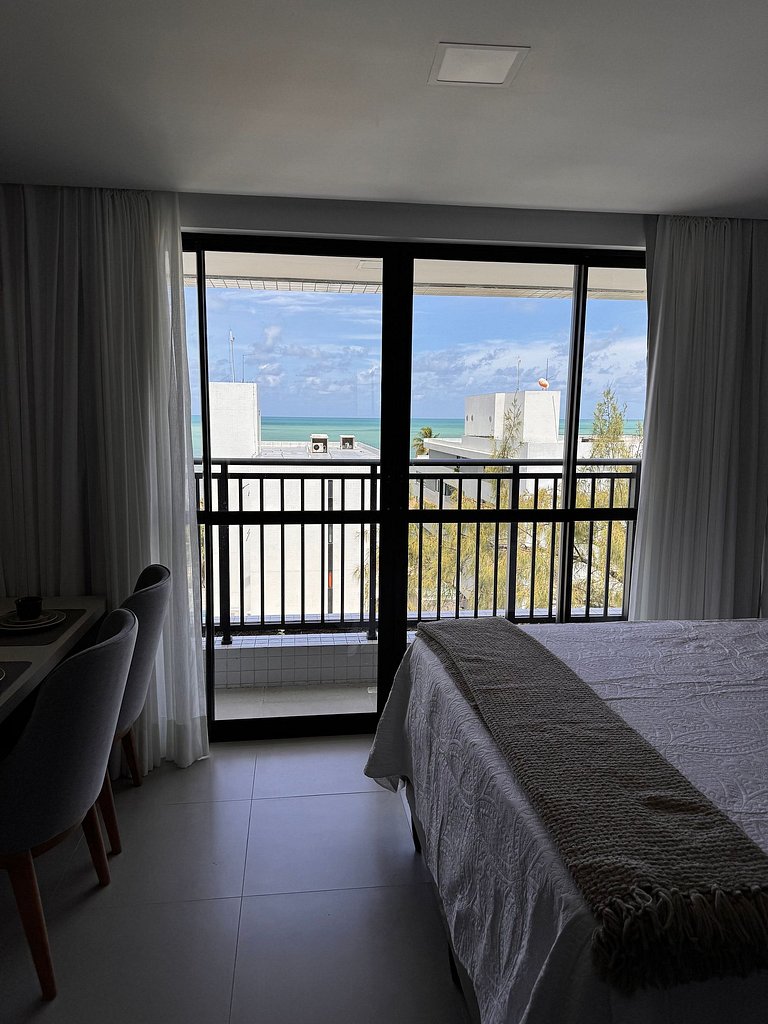 Studio estiloso com vista para o mar