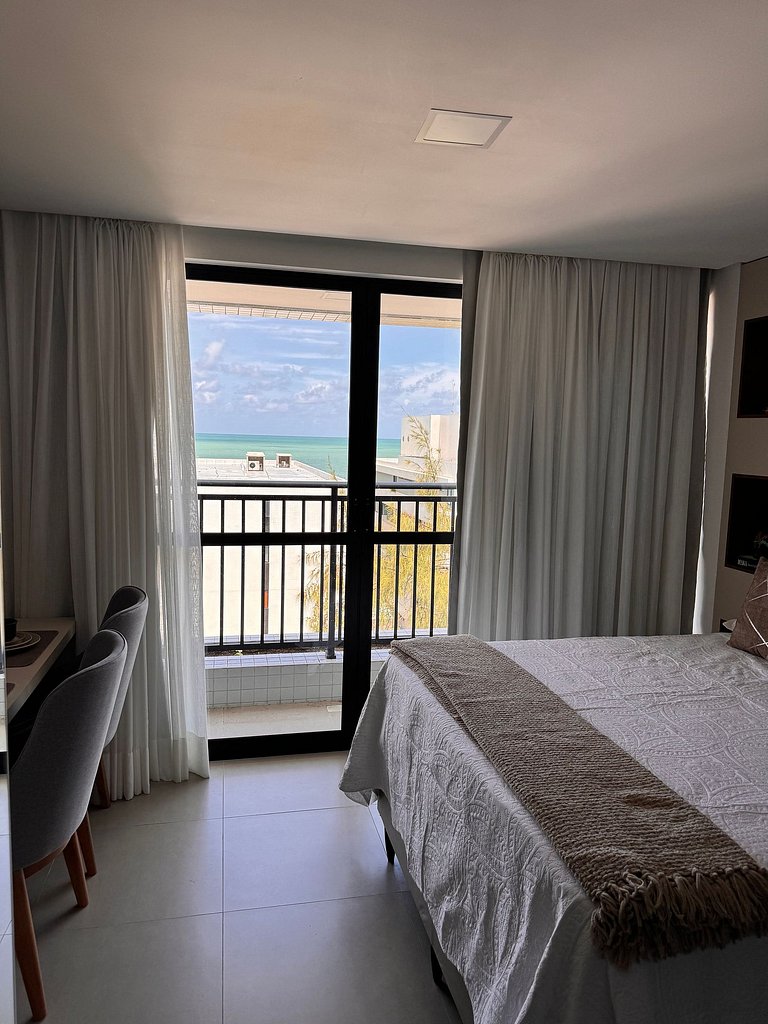 Studio estiloso com vista para o mar