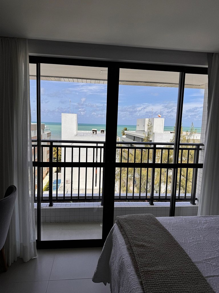 Studio estiloso com vista para o mar