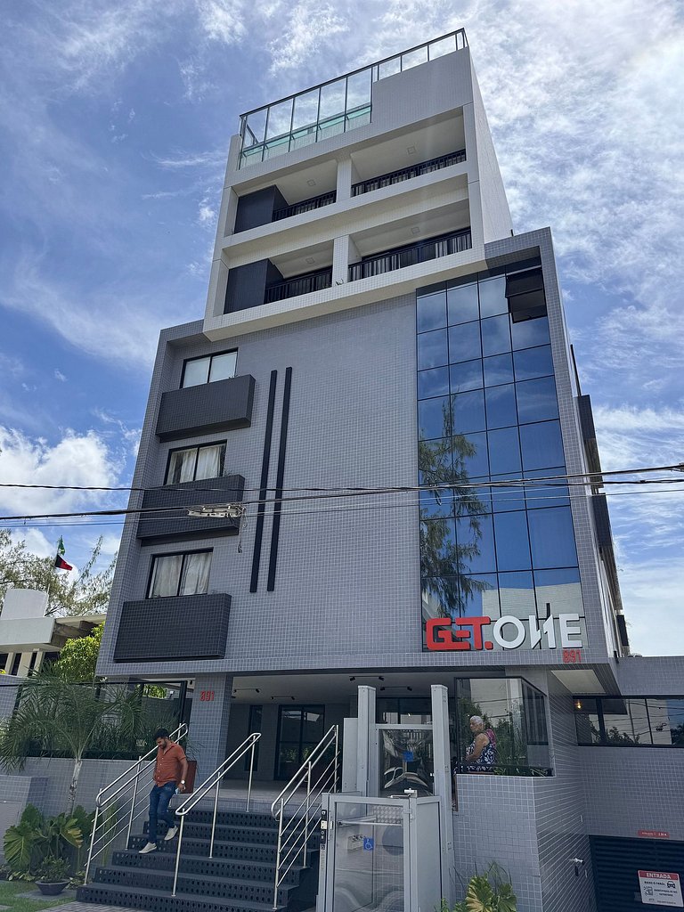 Studio estiloso com vista para o mar