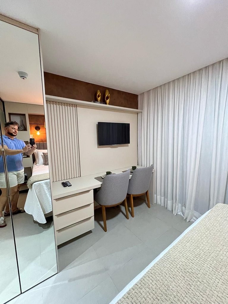 Studio estiloso com vista para o mar