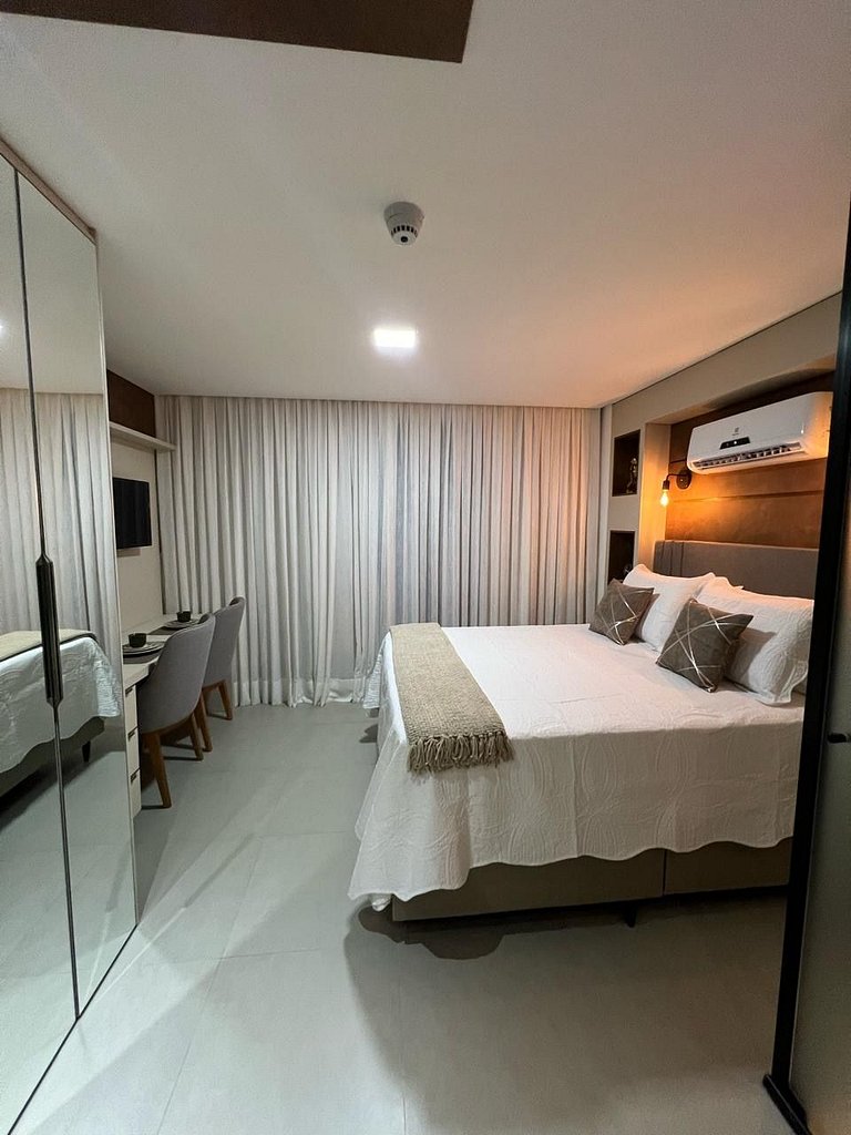 Studio estiloso com vista para o mar