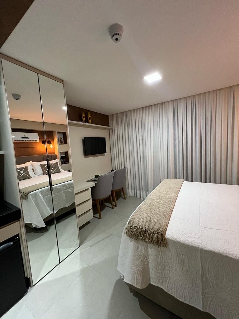 Studio estiloso com vista para o mar